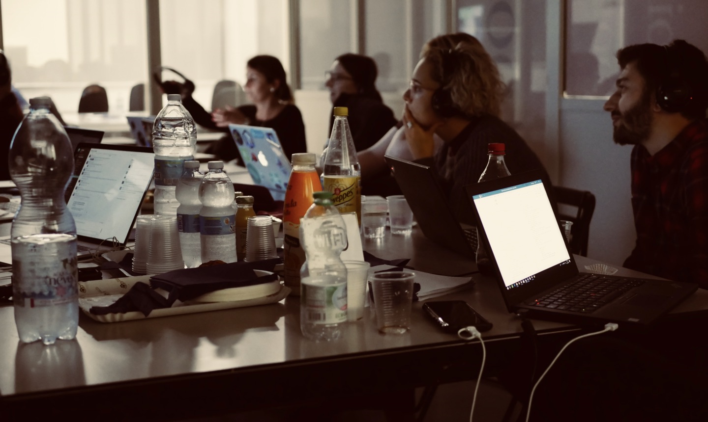 People at laptops during a research session